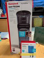 Front of boxed Honeywell humidifier with extra filter package