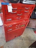 Full view of stacked red steel tool chest and cabinet