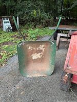 Front view showing pan interior rust and green paint