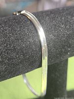 Full view of bracelet on display stand