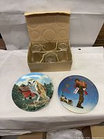 Lot overview with two plates and box of six glass votive jars
