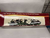 Retail box front showing product image and text 'Iron Tealight Holder with Glass Cup and Wreath and Tealights'