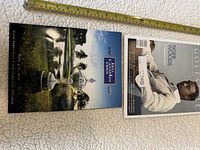 Front covers of program and magazine with measuring tape for scale