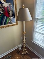 Full view of floor lamp beside window
