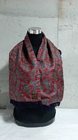 Front view showing paisley patterned side draped on mannequin