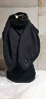 Front view of charcoal Lululemon wool scarf draped on mannequin