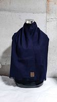Scarf draped on mannequin showing color and drape