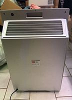Rear view showing louvered exhaust and overall cabinet