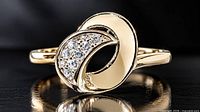 Front view of silver swirl ring with CZ stones