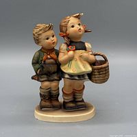 Front view of Goebel Hummel #49 To Market figurine showing children and basket