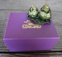 Pair of frog trinket boxes on purple Queen Anne box