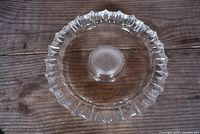 Top view of entire ashtray showing scalloped rim and frosted Senate seal center