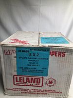 Closed cardboard box label showing box contains 25 bags of 8x2 Special Pancake Quadrex screws, black JS low root with CW#1/4x3 bit, manufactured by Leland Industries Inc., Canada.