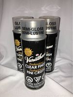 Three cans of Varathane clear finish spray including one semi-gloss and two gloss finish cans.
