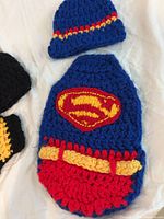 Superman cocoon and matching hat visible
