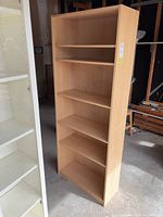 Full front view of the BILLY bookcase in garage setting