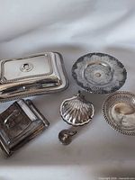 Group shot of all six silver-tone pieces