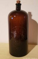 Front view showing embossing and cork