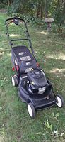 Front left view showing Craftsman mower, engine, wheels and bag