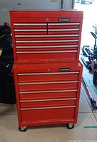 Front view of Husky red 2-piece tool chest combo showing all drawers closed