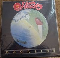 Front cover showing Heart logo and picture disc artwork