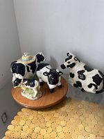 Group shot of all four cow ceramic items