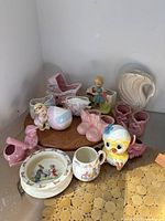 Group image of all planters, swan, Bunnykins plate and mug