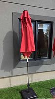 Umbrella closed showing pole and base