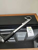 Entire boat hook showing length and hooked end