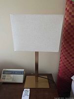 Full view of lamp with shade on tabletop