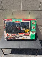 Front view of boxed Wintersville Express train set showing contents and branding