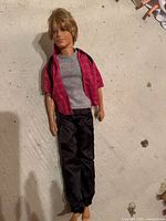 Front view of Ken doll with outfit