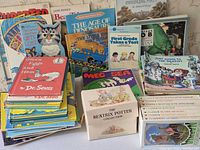 Front view showing stacked books, boxed sets in foreground