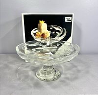 Plate on pedestal with original box behind