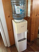 Front view of Primo water cooler with bottle attached