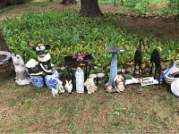 Wide view of entire assortment lined up on grass under trees