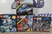 Group shot of all four sealed LEGO Star Wars set boxes