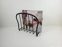Front view showing arched design holding a magazine