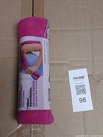 Rolled Gaiam pink microfiber yoga hand towel front label visible