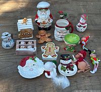 Full lot of ceramic holiday tableware, cookie jar, mugs, bowls, plates, figurines and plush ornaments