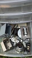 Drawer containing assorted electrical boxes, receptacles, switches, connectors and hardware