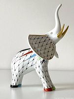 Left profile of fishnet porcelain elephant