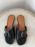 Top view of both sandals showing leather upper and buckle