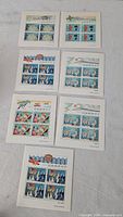 Seven miniature sheets laid out showing full lot