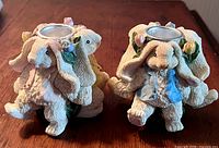 Front view showing both rabbit candle holders