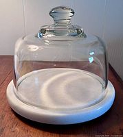 marble cheese board with glass dome in place