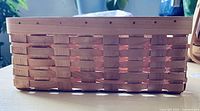 Side view of open rectangular wicker basket