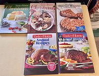 Group shot of all five Taste of Home hardcover cookbooks