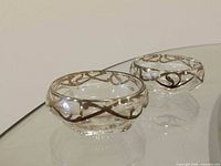 pair of clear glass salt cellars with sterling overlay