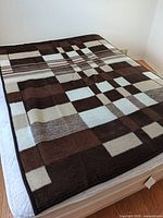 Blanket spread on mattress showing overall pattern and size